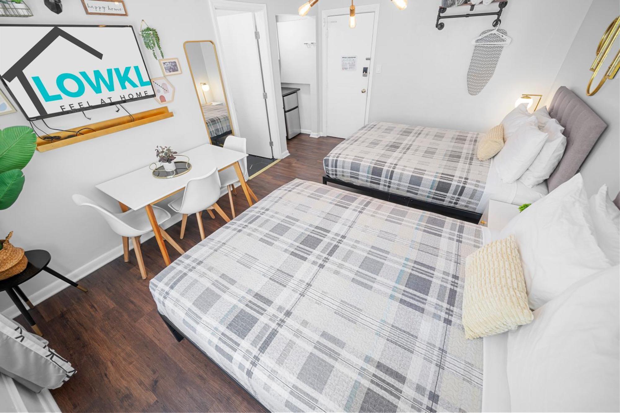 Deluxe Two Queen Beds Studio Kitchenette